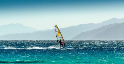 windsurfer rides on a background of high mountains in Egypt Dahab